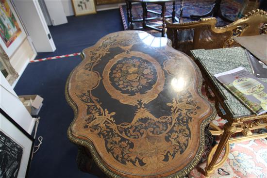 A 19th century Louis XV style marquetry, ebony and kingwood centre table, W.4ft 4in. D.2ft 9in. H.2ft 7in.